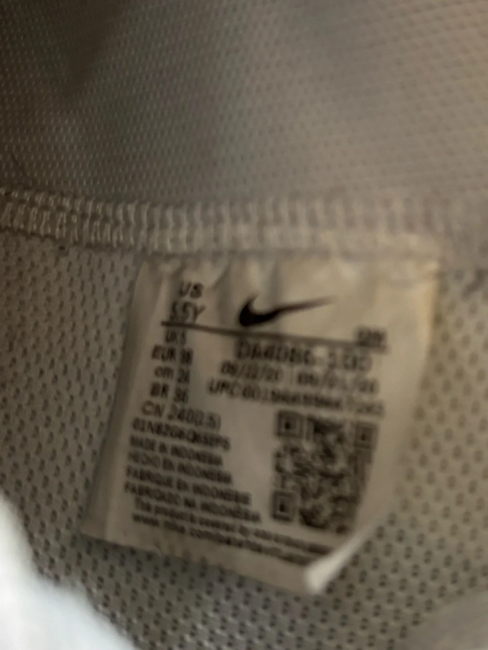 Nike Women’s White and Black High-Top Sneakers with Iconic Swoosh